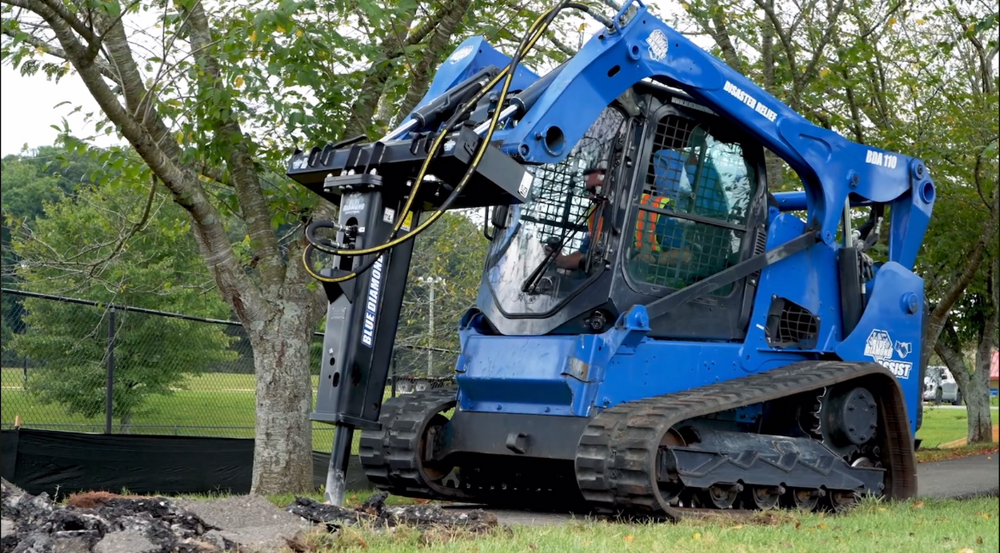 Heavy-duty attachments including mulchers and breakers on jobsite equipment