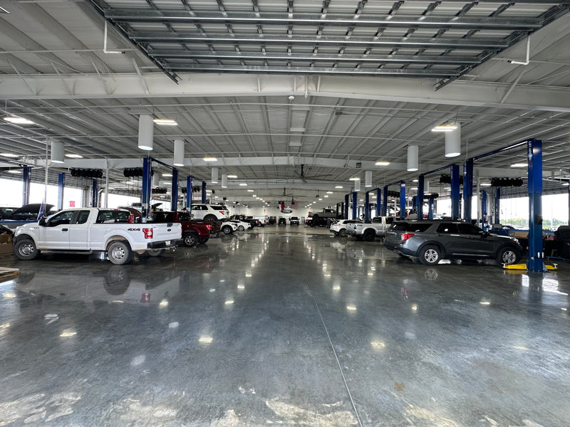Auto dealership service bay with professional shop equipment