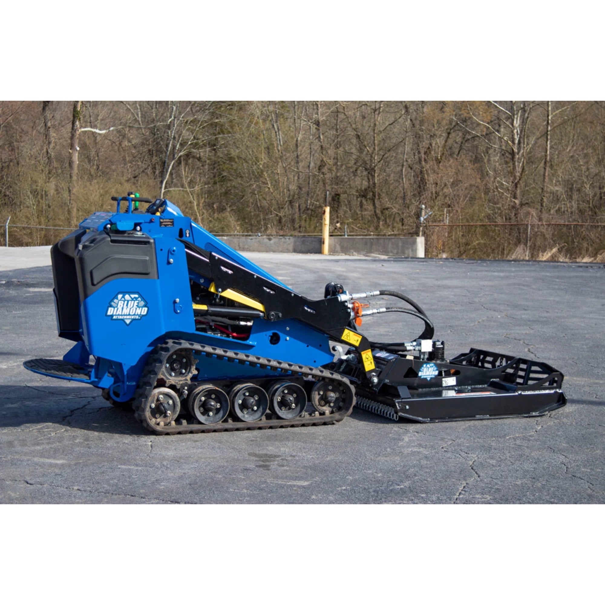 Blue Diamond mini skid steer open-front brush cutter mounted on mini track loader, side view