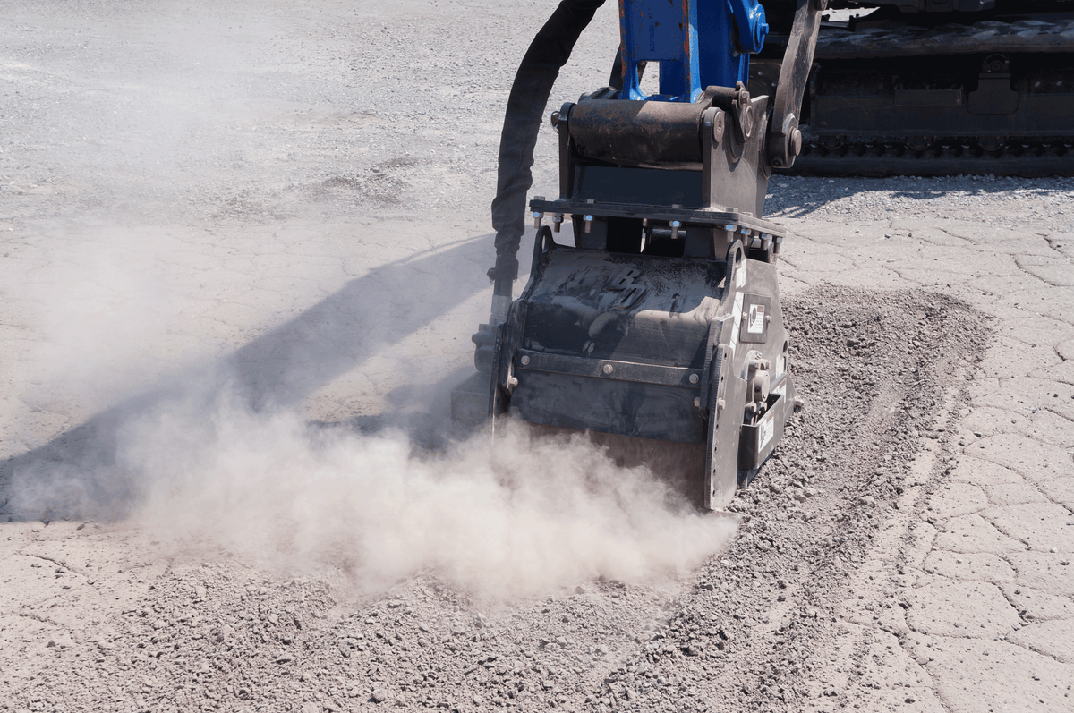 Blue Diamond Cold Planer — Mini Excavator — mounted on an excavator milling a paved surface
