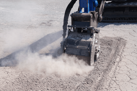 Blue Diamond Cold Planer — Mini Excavator — mounted on an excavator milling a paved surface
