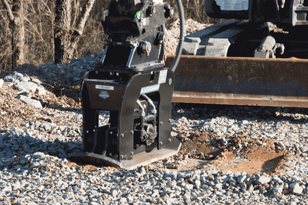 Blue Diamond Plate Compactor — mounted on an excavator compacting soil