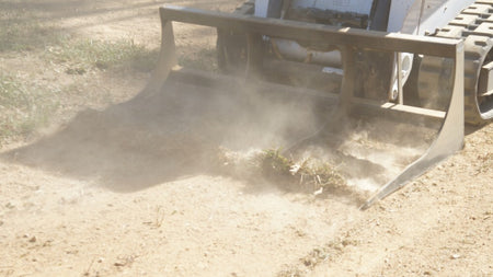 Blue Diamond Land Plane — mounted on a loader leveling soil