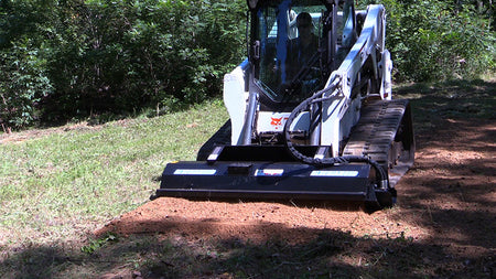 Blue Diamond Rototiller — mounted on a loader preparing soil