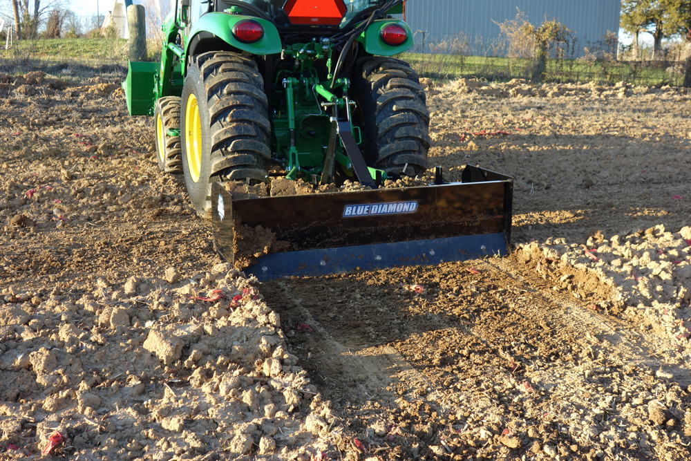 Blue Diamond Heavy Duty Compact Tractor Box Blade Scraper — mounted on a tractor grading soil