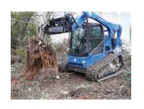 Blue Diamond Tree Puller — mounted on a compact track loader pulling vegetation