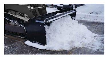 Blue Diamond Snow Pusher — mounted on a loader pushing snow