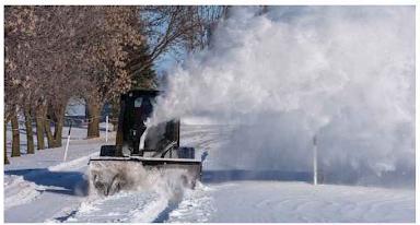Blue Diamond Snow Blower — Extreme Duty — mounted on a loader blowing snow