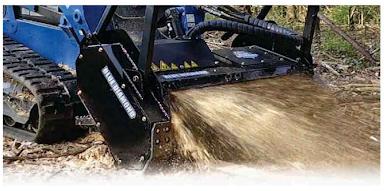 Blue Diamond Drum Mulcher — Severe Duty — mounted on a loader mulching vegetation