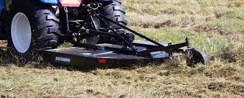 Blue Diamond Standard Duty Tractor Rotary Cutter — mounted on a tractor cutting grass