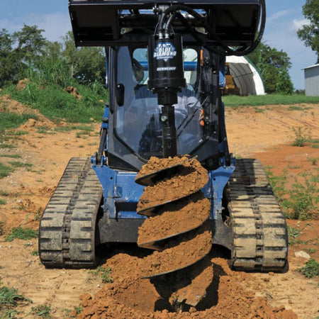Blue Diamond Extreme Duty Series 2 Auger Drive — mounted on a loader drilling into soil