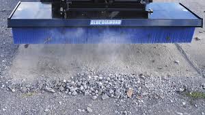 Blue Diamond Broom — Push Heavy Duty & Standard Duty — blue bristles sweeping gravel