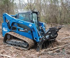 Blue Diamond Severe Duty Grapple Rake — mounted on a compact track loader handling brush